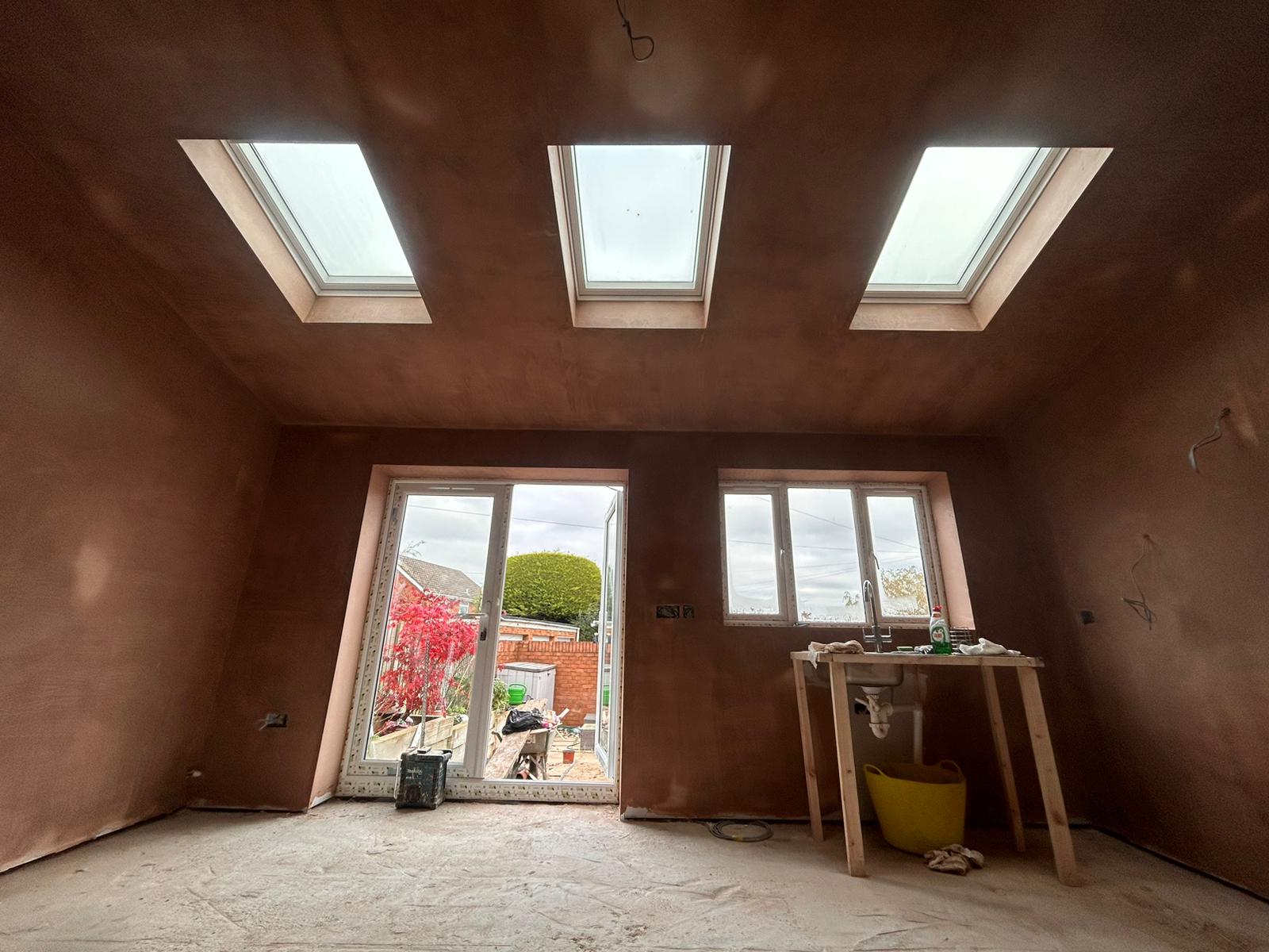 Front rooms walls and ceiling freshly plastered