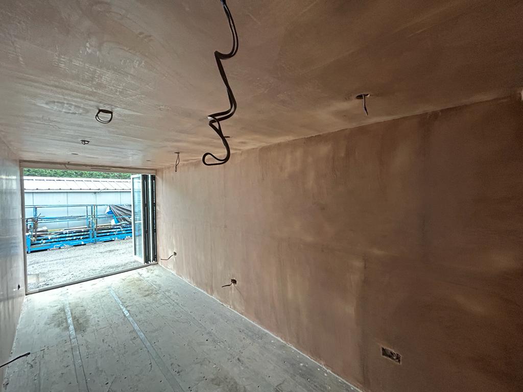 Internal walls and ceiling of a shipping container that has been plastered in Willsbridge, Bristol