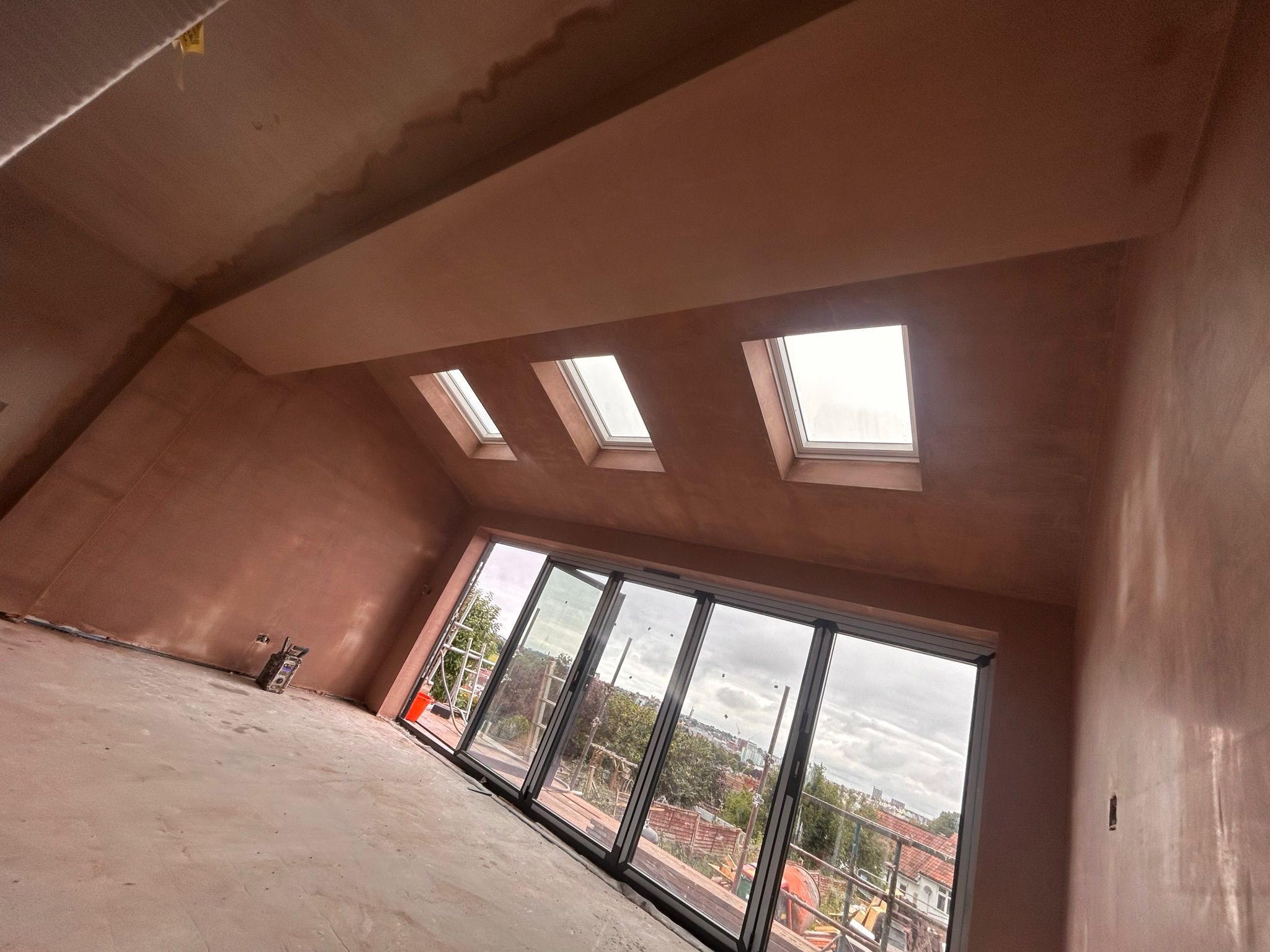 New extension walls and ceiling plastered 
