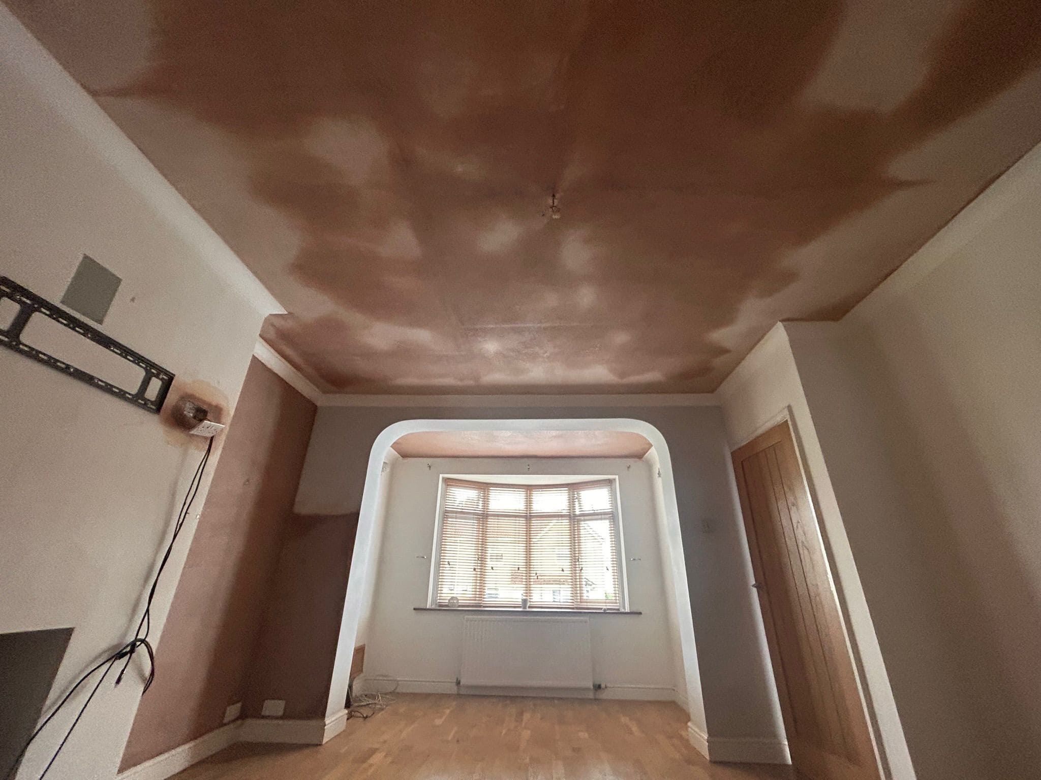 Front rooms walls and ceiling freshly plastered